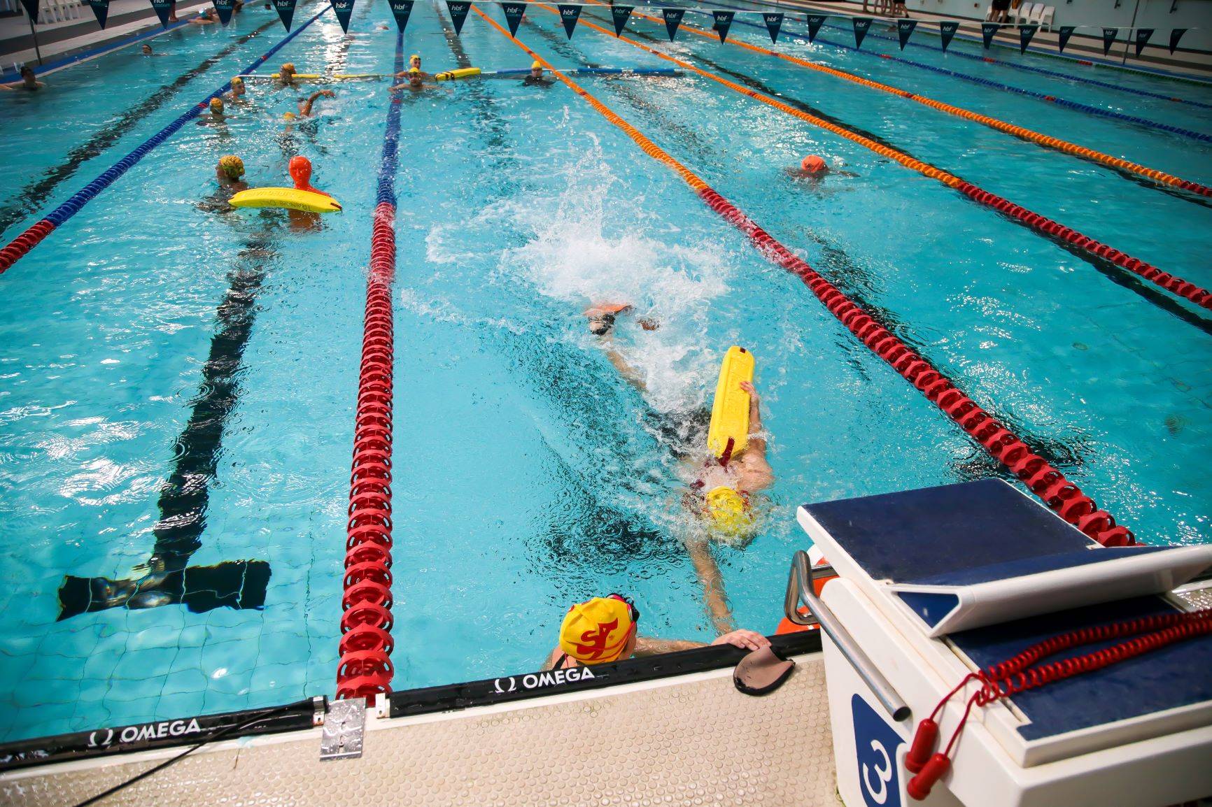 People competing in a Pool Lifesaving Competition