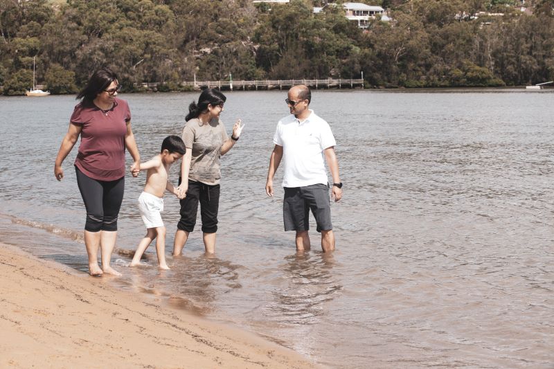 Family walking by the Water.